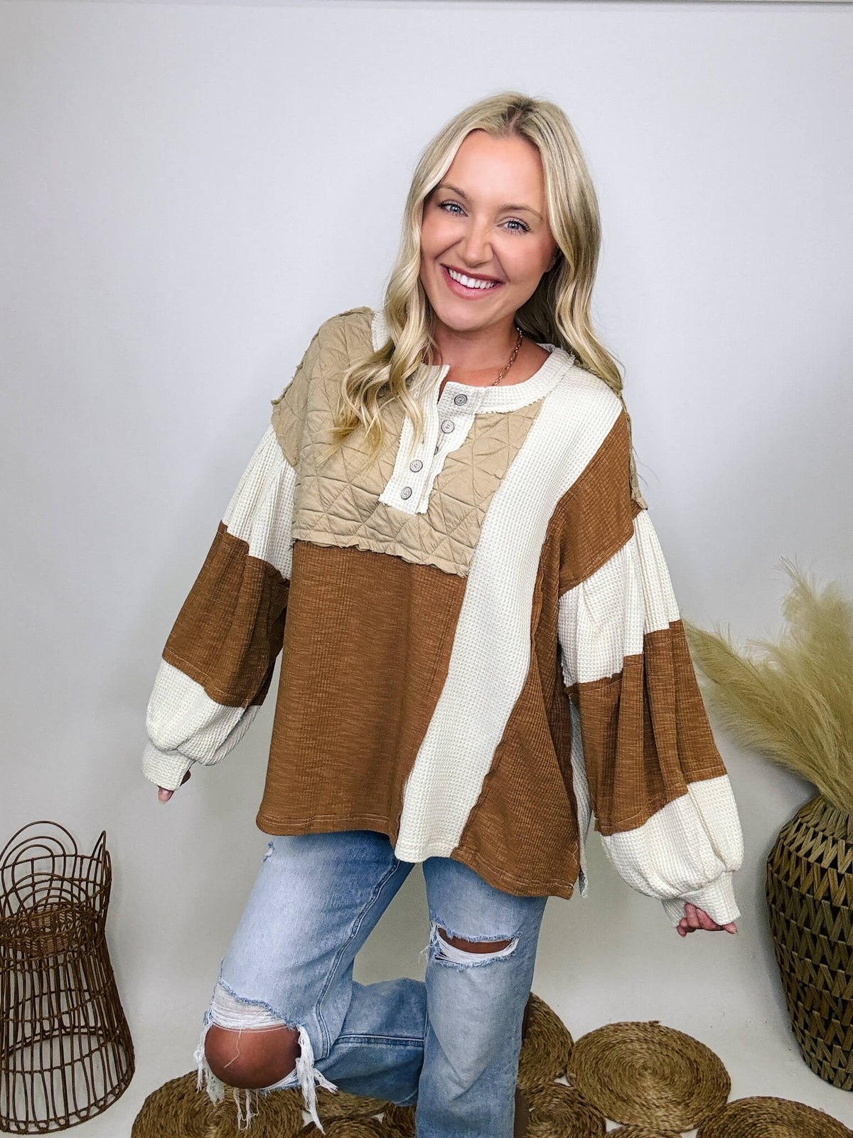 POL Clothing Oat Chocolate Cognac tan and ivory thermal top with quilted contrast patchwork, round neck, balloon sleeves, and henley button-up design.