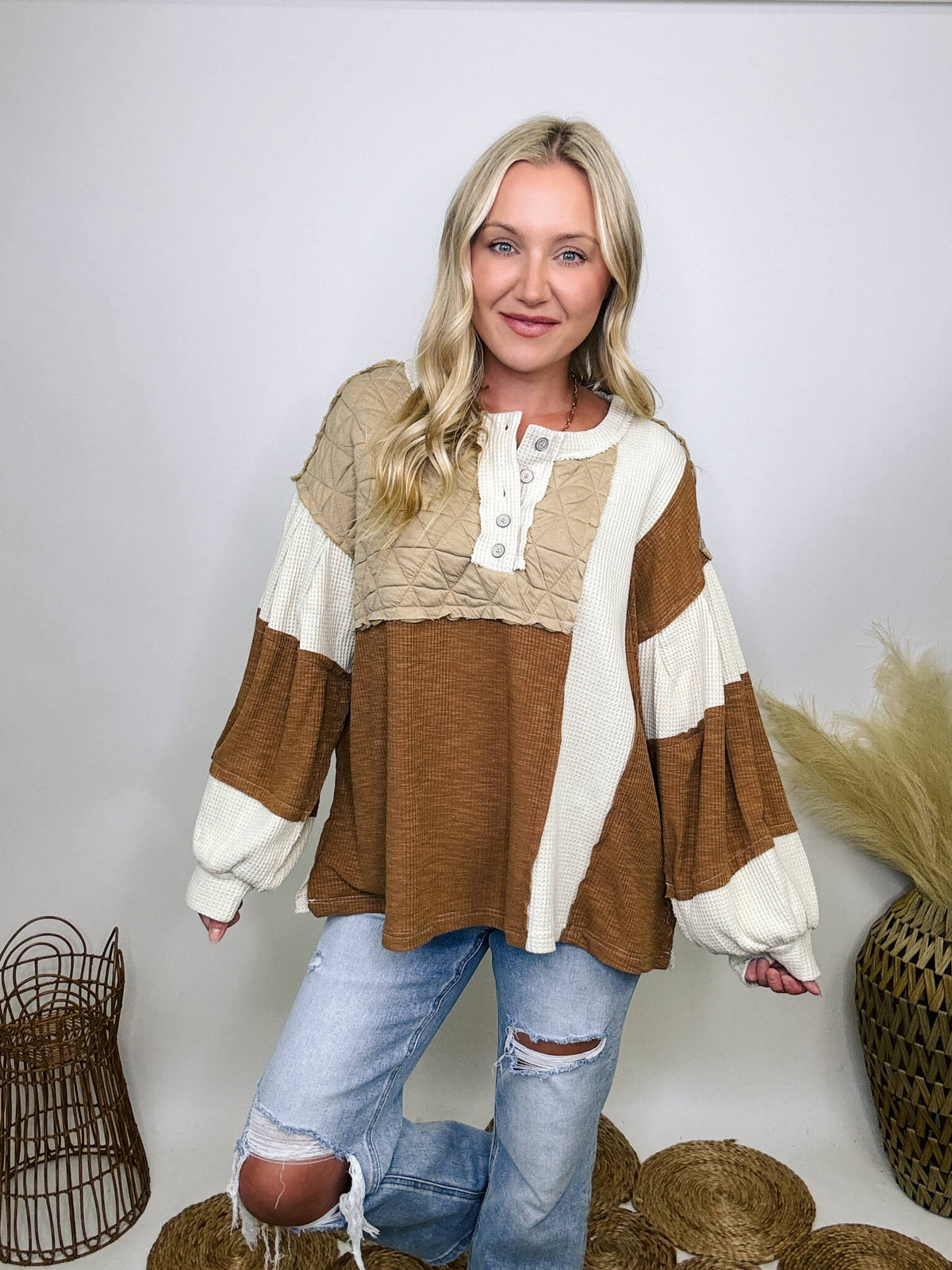 POL Clothing Oat Chocolate Cognac tan and ivory thermal top with quilted contrast patchwork, round neck, balloon sleeves, and henley button-up design.