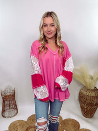 POL Hot Pink and Lace Patch Long Sleeve Boho Top in Hot Pink by POL Clothing with floral lace details, v-neckline, balloon sleeves, and side slits for a chic, stylish look.