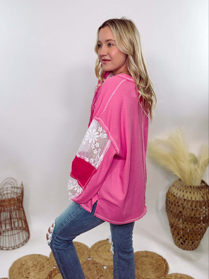 POL Hot Pink and Lace Patch Long Sleeve Boho Top in Hot Pink by POL Clothing with floral lace details, v-neckline, balloon sleeves, and side slits for a chic, stylish look.