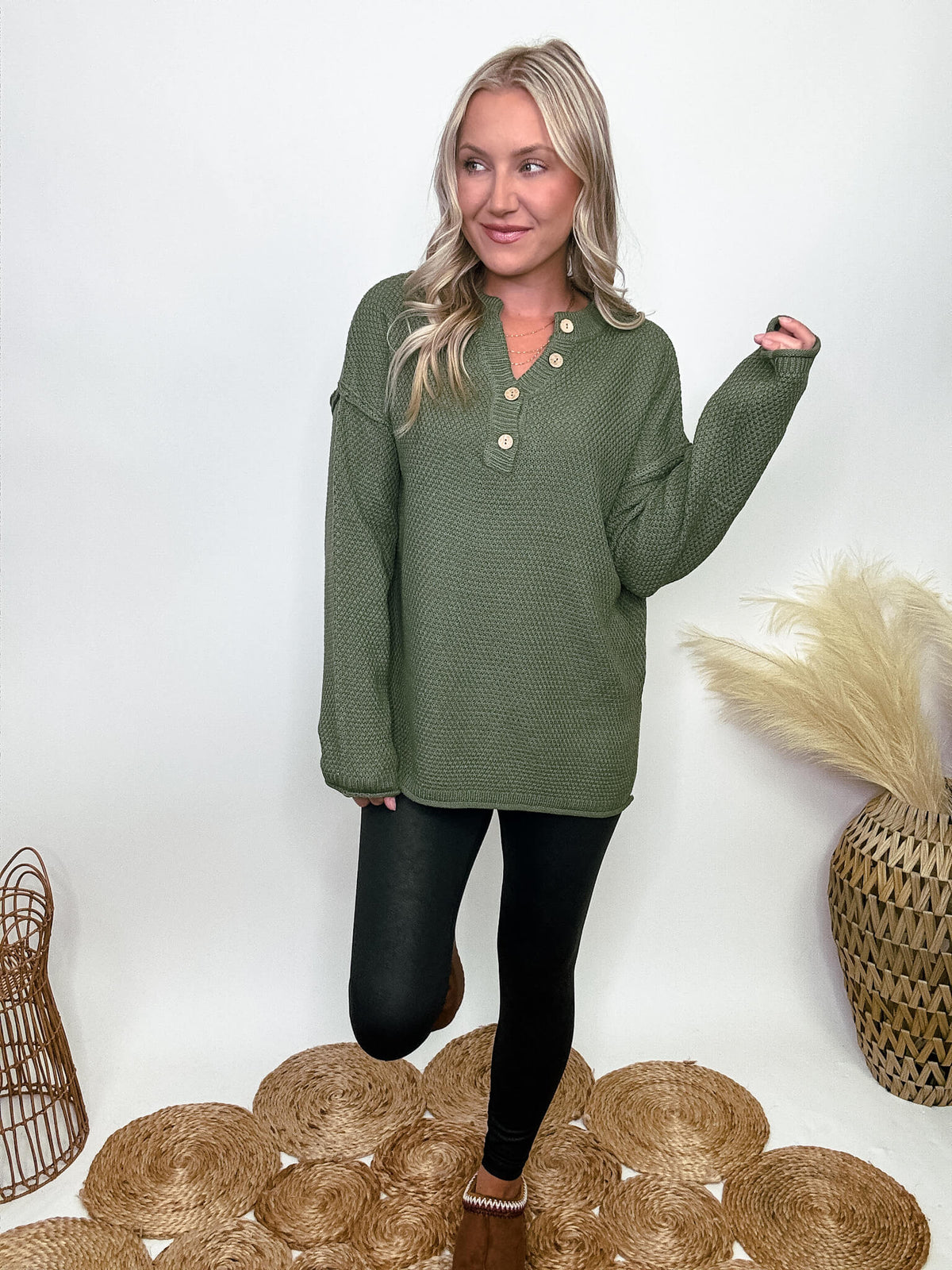 Zenana Olive green midweight sweater with 4-button Henley neckline, side slits, and relaxed fit. Made from 100% acrylic. Model Brooke is 5'4" wearing size small.