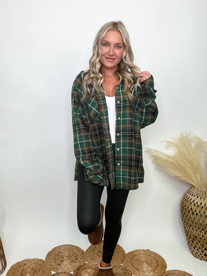 Aemi and CO Green plaid flannel oversized shirt with button-up front, chest pocket, and side step hem, made of 65% polyester and 35% cotton, perfect for layering and fall fashion.