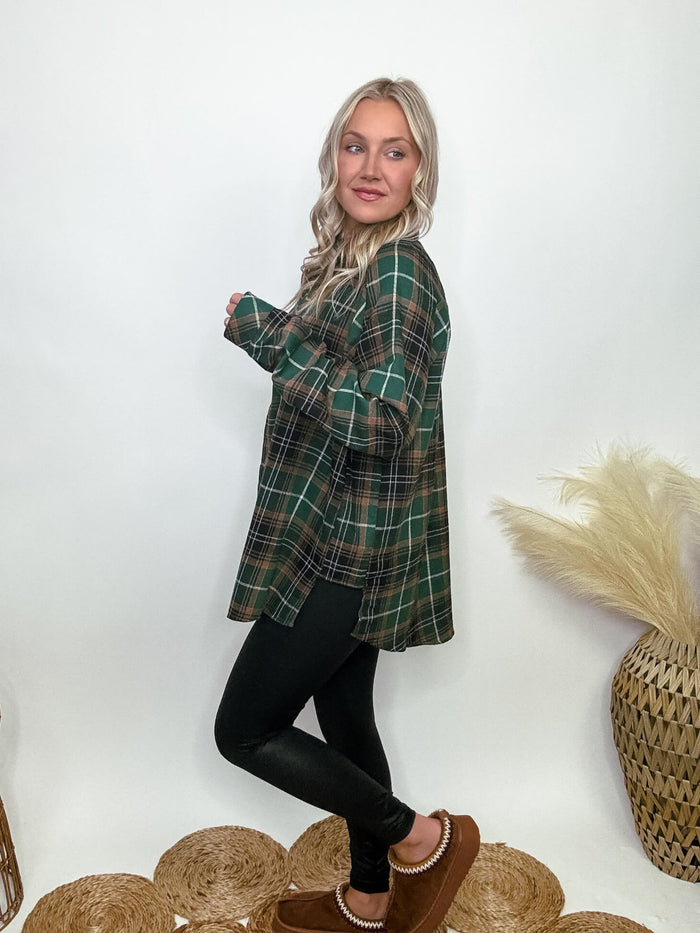 Aemi and CO Green plaid flannel oversized shirt with button-up front, chest pocket, and side step hem, made of 65% polyester and 35% cotton, perfect for layering and fall fashion.