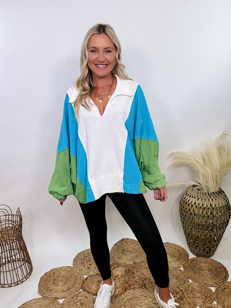 Bucketlist Blue, green, and white reverse French terry oversized pullover with v-neckline, collar, and long sleeves