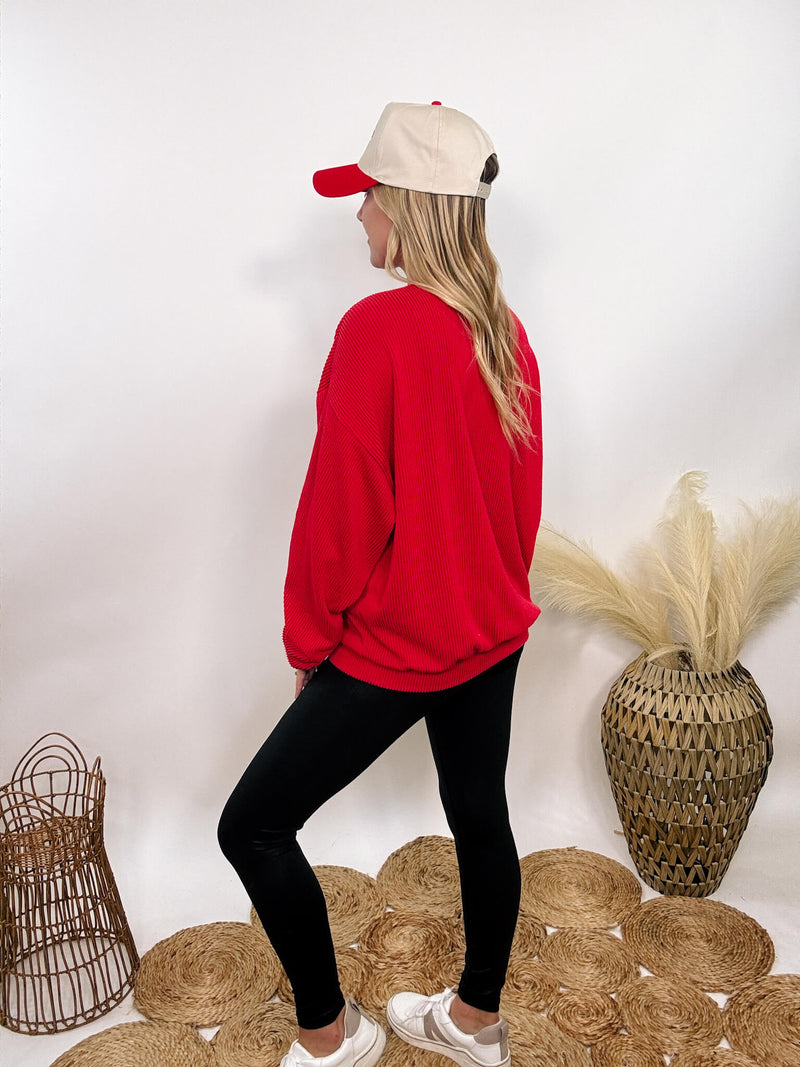 Red Nebraska corded oversized crewneck pullover, perfect for Husker fans, made from 95% polyester and 5% spandex for a stretchy, comfortable fit.