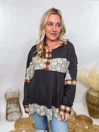 Charcoal thermal Henley by POL with plaid patchwork and lace details. Features Henley button neckline, plaid hoodie, and flowy oversized fit with ruffle hem. Perfect for cozy fall or winter outfits.