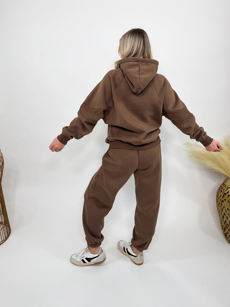 Chocolate brown fleece-lined luxury lounge Bmaes hoodie with embroidered Bmaes Boutique logo, drop shoulders, kangaroo pocket, and ribbed details. Perfect for cozy lounging or pairing with the matching joggers for a stylish, warm set from Bmaes Boutique.