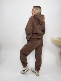 Chocolate brown fleece-lined luxury lounge Bmaes hoodie with embroidered Bmaes Boutique logo, drop shoulders, kangaroo pocket, and ribbed details. Perfect for cozy lounging or pairing with the matching joggers for a stylish, warm set from Bmaes Boutique.