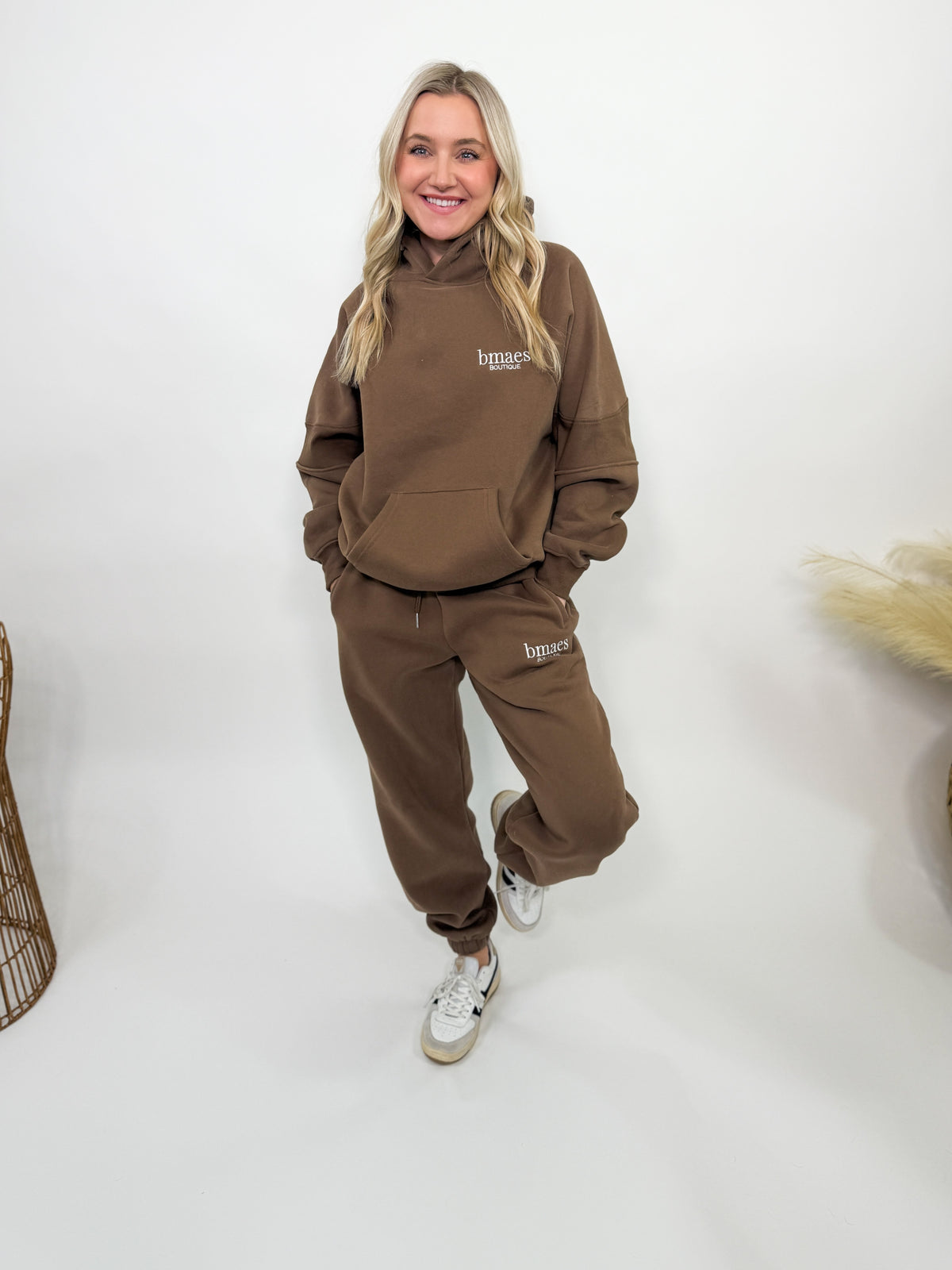 Chocolate brown fleece-lined luxury lounge Bmaes hoodie with embroidered Bmaes Boutique logo, drop shoulders, kangaroo pocket, and ribbed details. Perfect for cozy lounging or pairing with the matching joggers for a stylish, warm set from Bmaes Boutique.