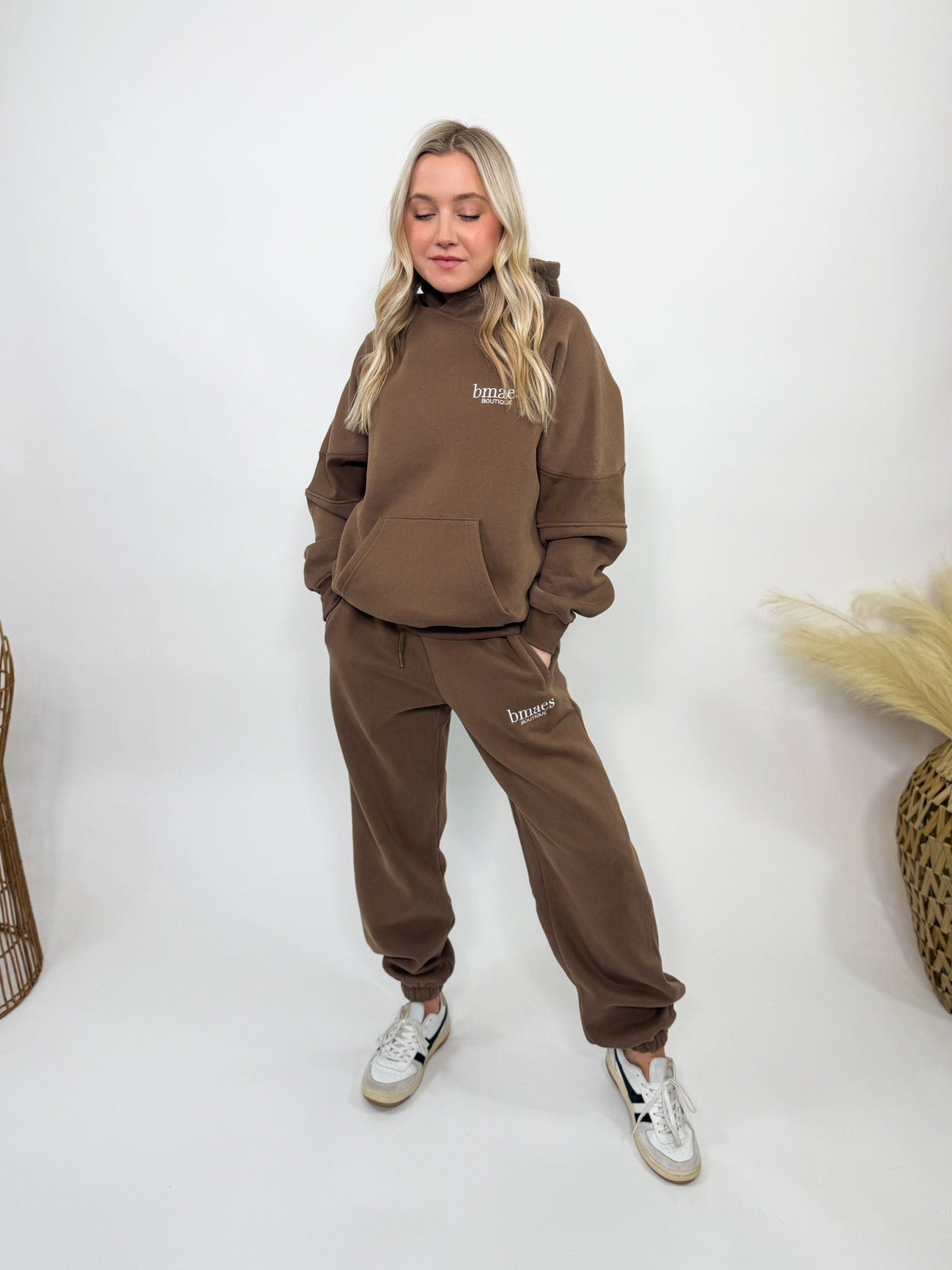 Chocolate brown fleece-lined luxury lounge Bmaes hoodie with embroidered Bmaes Boutique logo, drop shoulders, kangaroo pocket, and ribbed details. Perfect for cozy lounging or pairing with the matching joggers for a stylish, warm set from Bmaes Boutique.