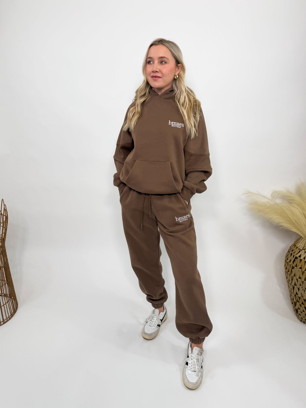 Chocolate brown fleece-lined luxury lounge Bmaes hoodie with embroidered Bmaes Boutique logo, drop shoulders, kangaroo pocket, and ribbed details. Perfect for cozy lounging or pairing with the matching joggers for a stylish, warm set from Bmaes Boutique.