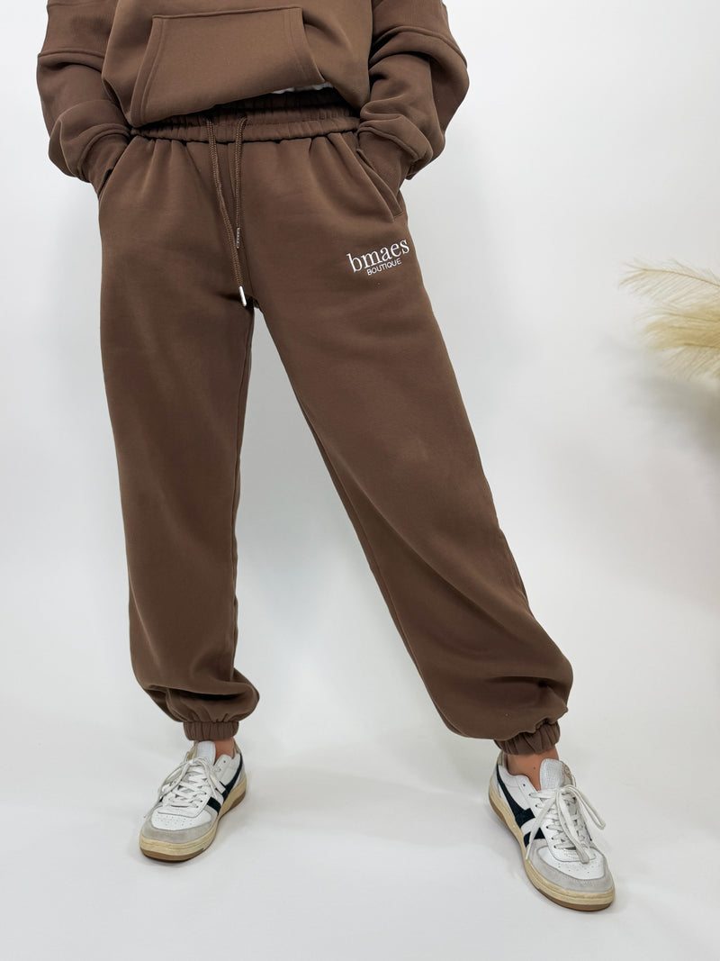 Chocolate brown fleece-lined luxury lounge Bmaes joggers with elastic drawstring waistband, deep pockets, and elastic ankle cuffs. Perfect for lounging or pairing with the matching hoodie for a chic, cozy set from Bmaes Boutique.