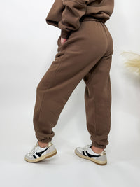 Chocolate brown fleece-lined luxury lounge Bmaes joggers with elastic drawstring waistband, deep pockets, and elastic ankle cuffs. Perfect for lounging or pairing with the matching hoodie for a chic, cozy set from Bmaes Boutique.