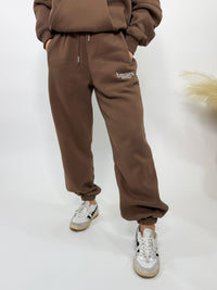 Chocolate brown fleece-lined luxury lounge Bmaes joggers with elastic drawstring waistband, deep pockets, and elastic ankle cuffs. Perfect for lounging or pairing with the matching hoodie for a chic, cozy set from Bmaes Boutique.