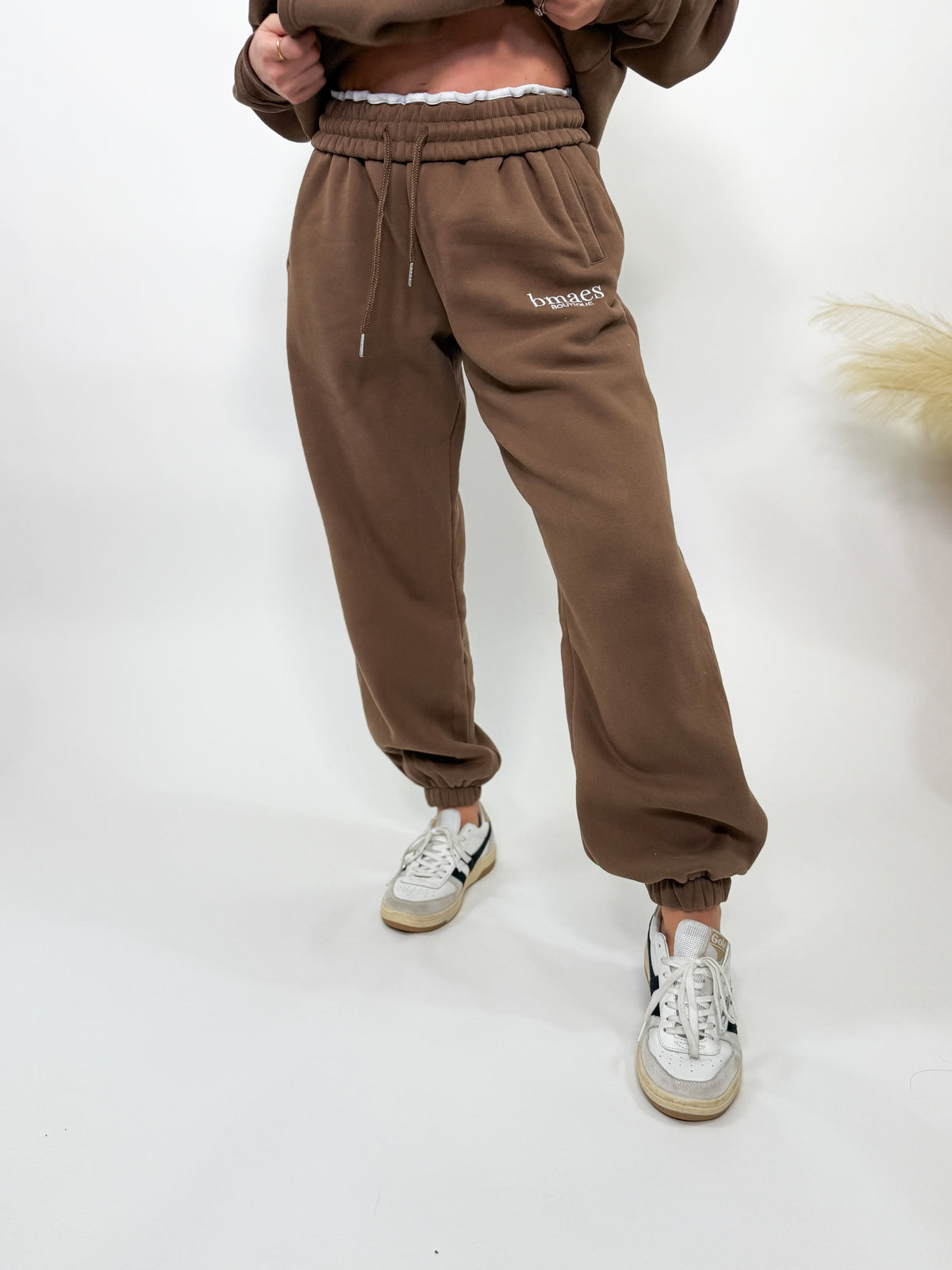 Chocolate brown fleece-lined luxury lounge Bmaes joggers with elastic drawstring waistband, deep pockets, and elastic ankle cuffs. Perfect for lounging or pairing with the matching hoodie for a chic, cozy set from Bmaes Boutique.