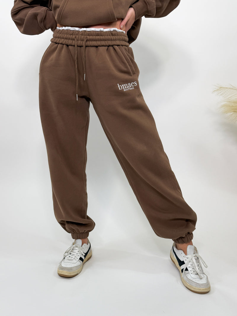 Chocolate brown fleece-lined luxury lounge Bmaes joggers with elastic drawstring waistband, deep pockets, and elastic ankle cuffs. Perfect for lounging or pairing with the matching hoodie for a chic, cozy set from Bmaes Boutique.