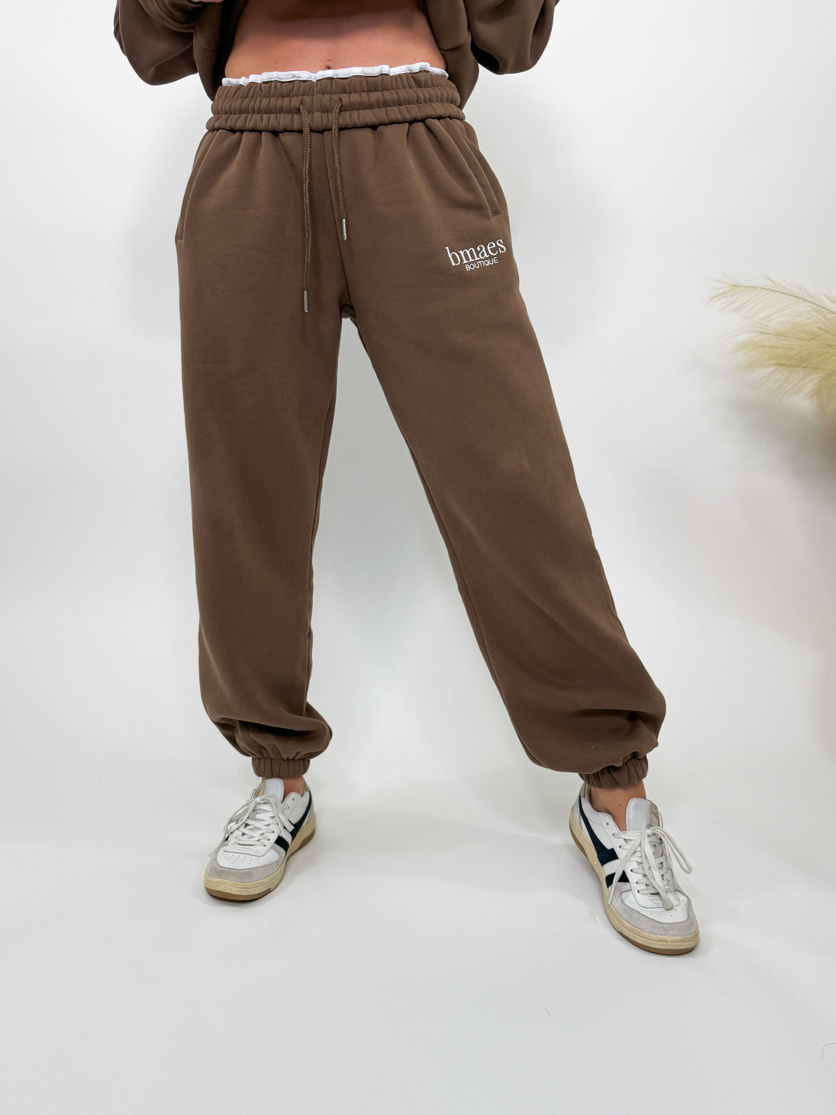 Chocolate brown fleece-lined luxury lounge Bmaes joggers with elastic drawstring waistband, deep pockets, and elastic ankle cuffs. Perfect for lounging or pairing with the matching hoodie for a chic, cozy set from Bmaes Boutique.