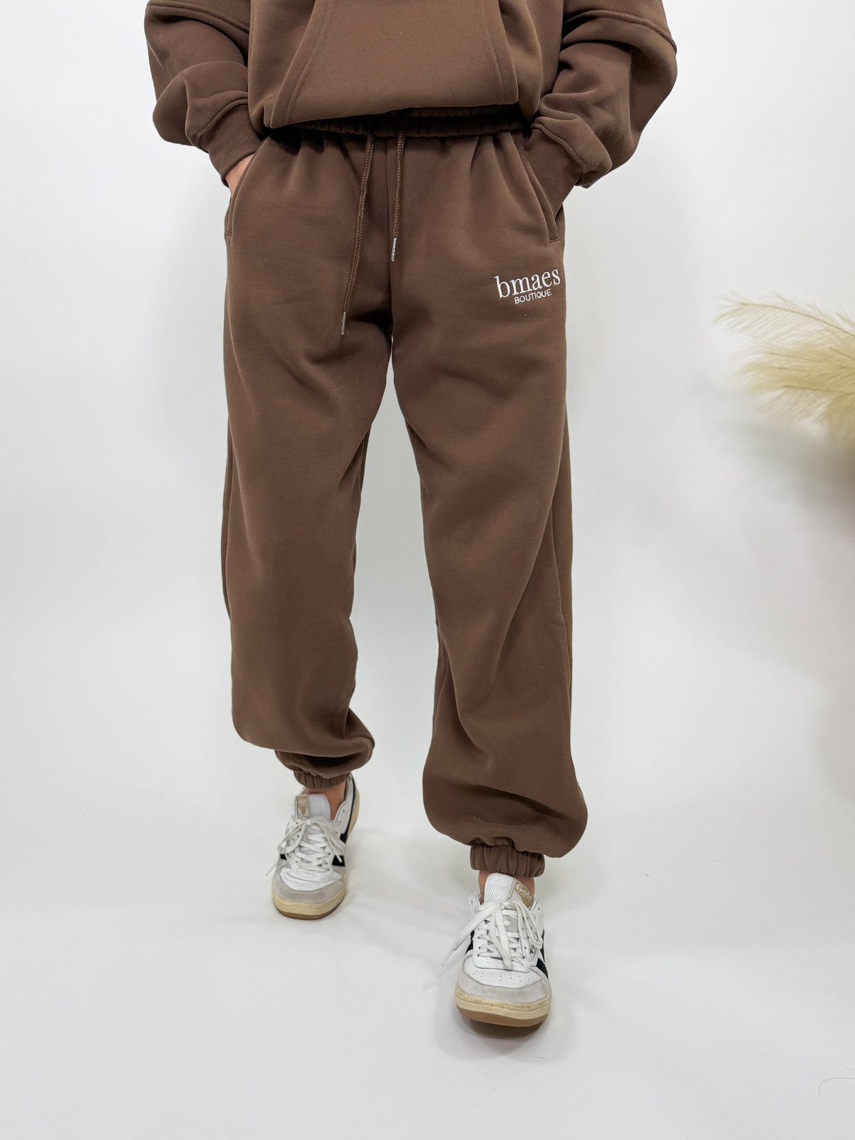 Chocolate brown fleece-lined luxury lounge Bmaes joggers with elastic drawstring waistband, deep pockets, and elastic ankle cuffs. Perfect for lounging or pairing with the matching hoodie for a chic, cozy set from Bmaes Boutique.