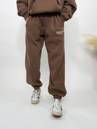 Chocolate brown fleece-lined luxury lounge Bmaes joggers with elastic drawstring waistband, deep pockets, and elastic ankle cuffs. Perfect for lounging or pairing with the matching hoodie for a chic, cozy set from Bmaes Boutique.