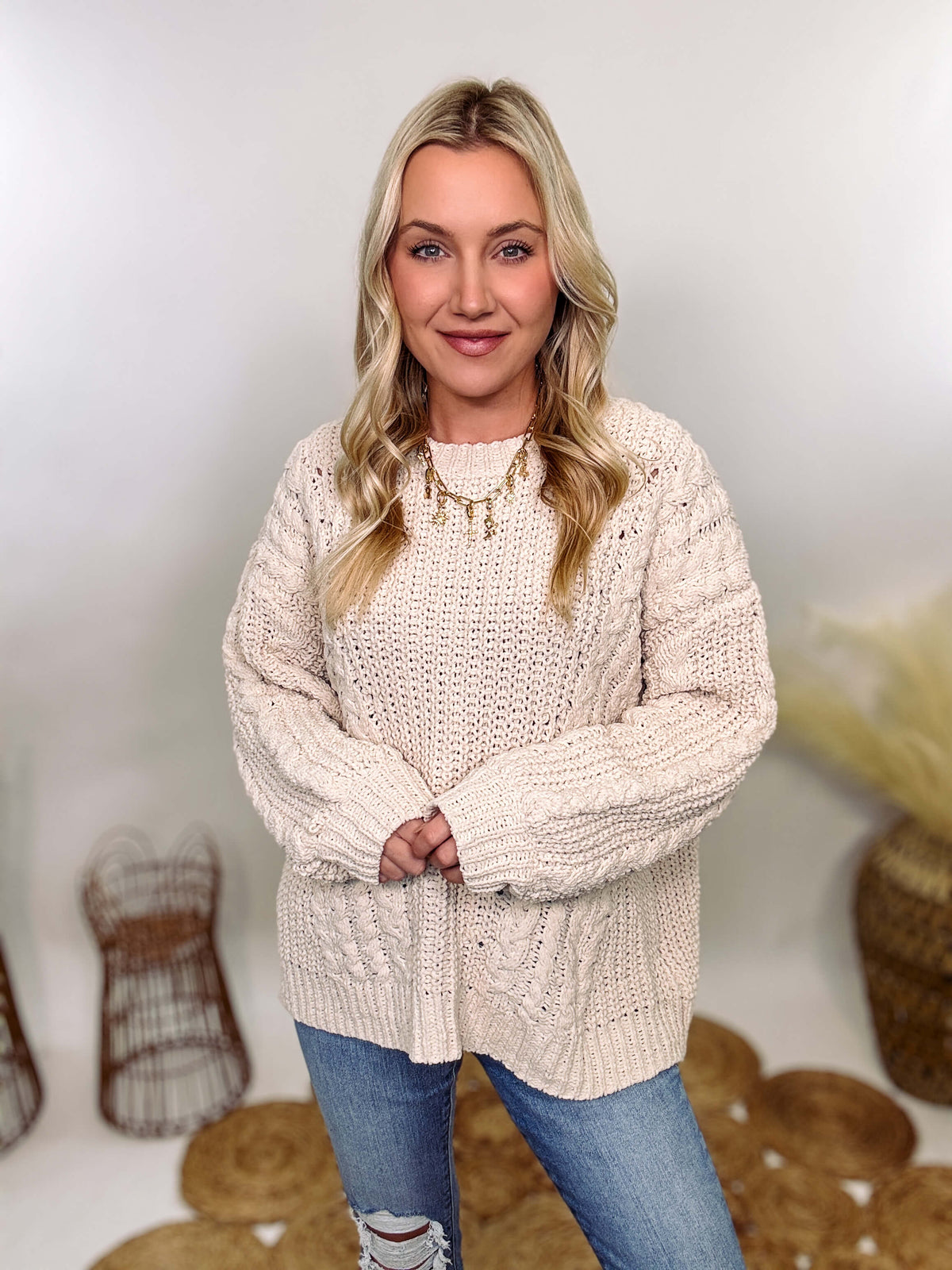 Cream oversized knit sweater by POL featuring a super soft chenille-like texture, premium quality, and 100% polyester material. Designed with an oversized fit for cozy comfort and versatile winter styling.