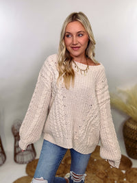 Cream oversized knit sweater by POL featuring a super soft chenille-like texture, premium quality, and 100% polyester material. Designed with an oversized fit for cozy comfort and versatile winter styling.