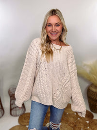 Cream oversized knit sweater by POL featuring a super soft chenille-like texture, premium quality, and 100% polyester material. Designed with an oversized fit for cozy comfort and versatile winter styling.