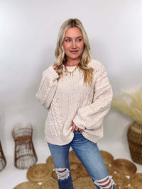 Cream oversized knit sweater by POL featuring a super soft chenille-like texture, premium quality, and 100% polyester material. Designed with an oversized fit for cozy comfort and versatile winter styling.