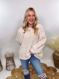 Cream oversized knit sweater by POL featuring a super soft chenille-like texture, premium quality, and 100% polyester material. Designed with an oversized fit for cozy comfort and versatile winter styling.