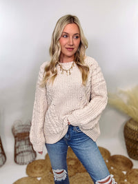 Cream oversized knit sweater by POL featuring a super soft chenille-like texture, premium quality, and 100% polyester material. Designed with an oversized fit for cozy comfort and versatile winter styling.