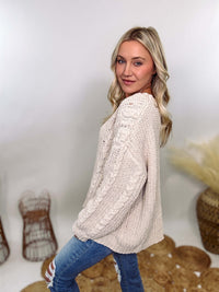 Cream oversized knit sweater by POL featuring a super soft chenille-like texture, premium quality, and 100% polyester material. Designed with an oversized fit for cozy comfort and versatile winter styling.