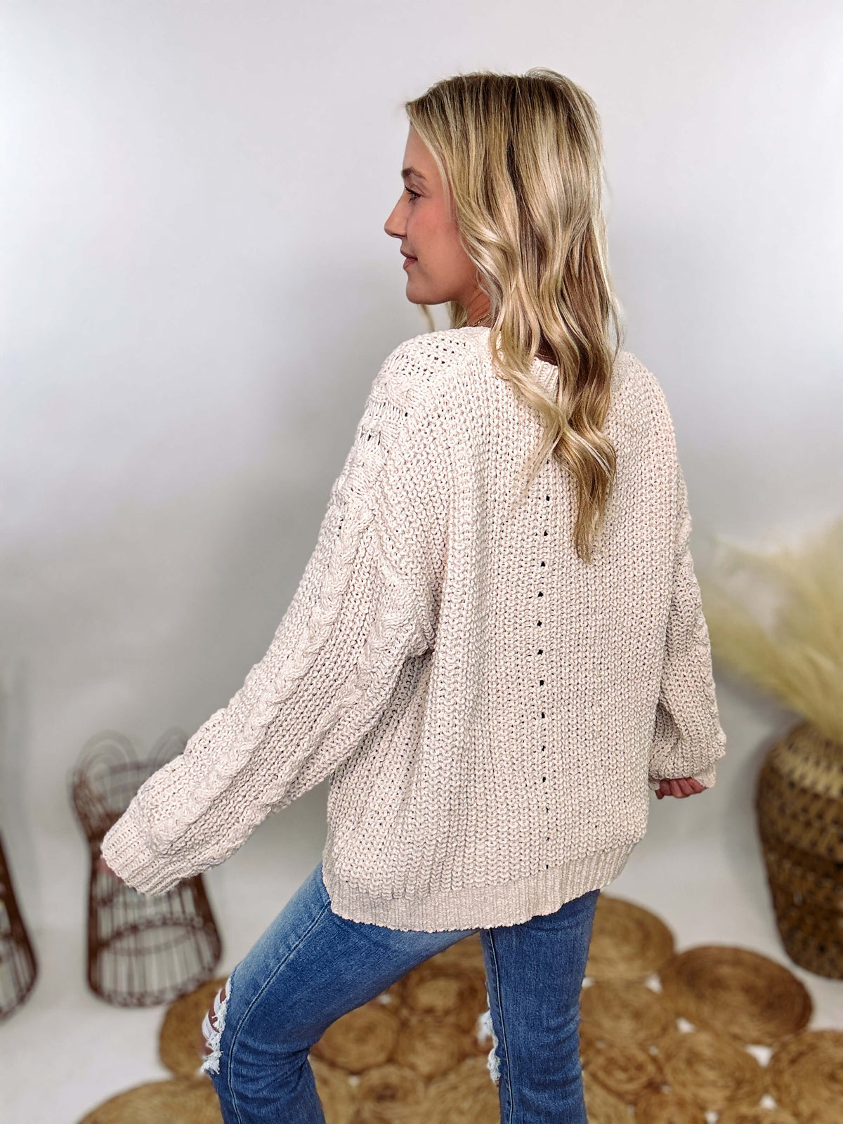 Cream oversized knit sweater by POL featuring a super soft chenille-like texture, premium quality, and 100% polyester material. Designed with an oversized fit for cozy comfort and versatile winter styling.