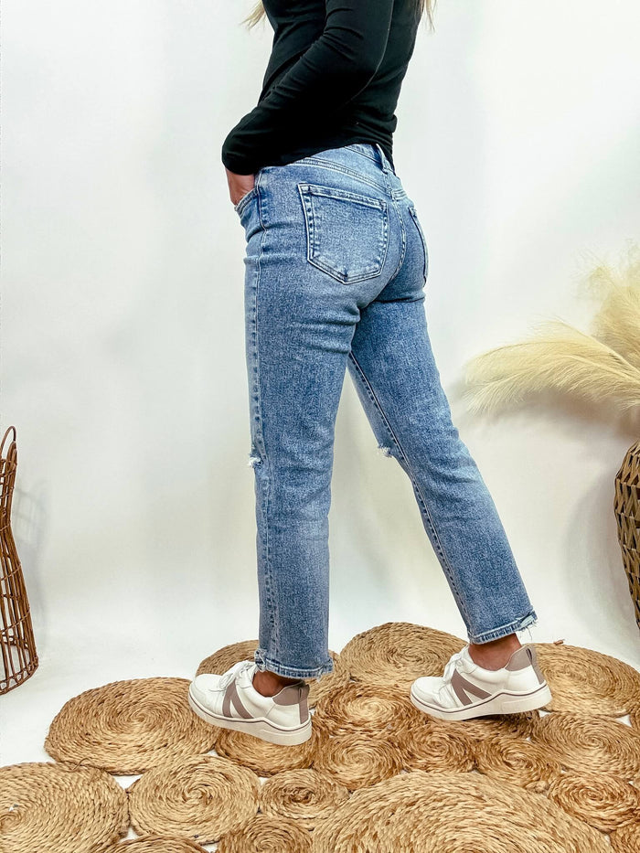 Flying Monkey High-rise distressed cropped straight leg jeans in light medium wash denim with comfort stretch, styled casually with sneakers or ankle boots.