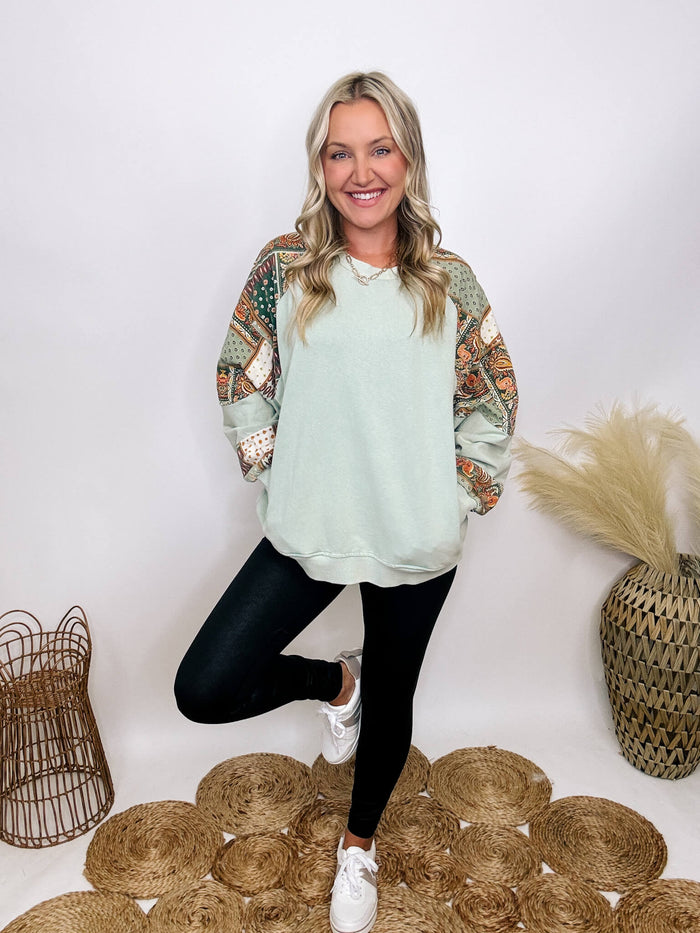 Easel Washed sage oversized pullover with side pockets, round neckline, dropped shoulders, and paisley pattern details