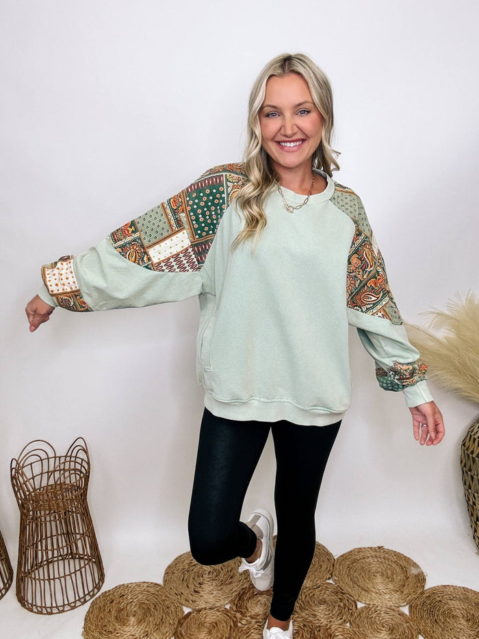 Easel Washed sage oversized pullover with side pockets, round neckline, dropped shoulders, and paisley pattern details