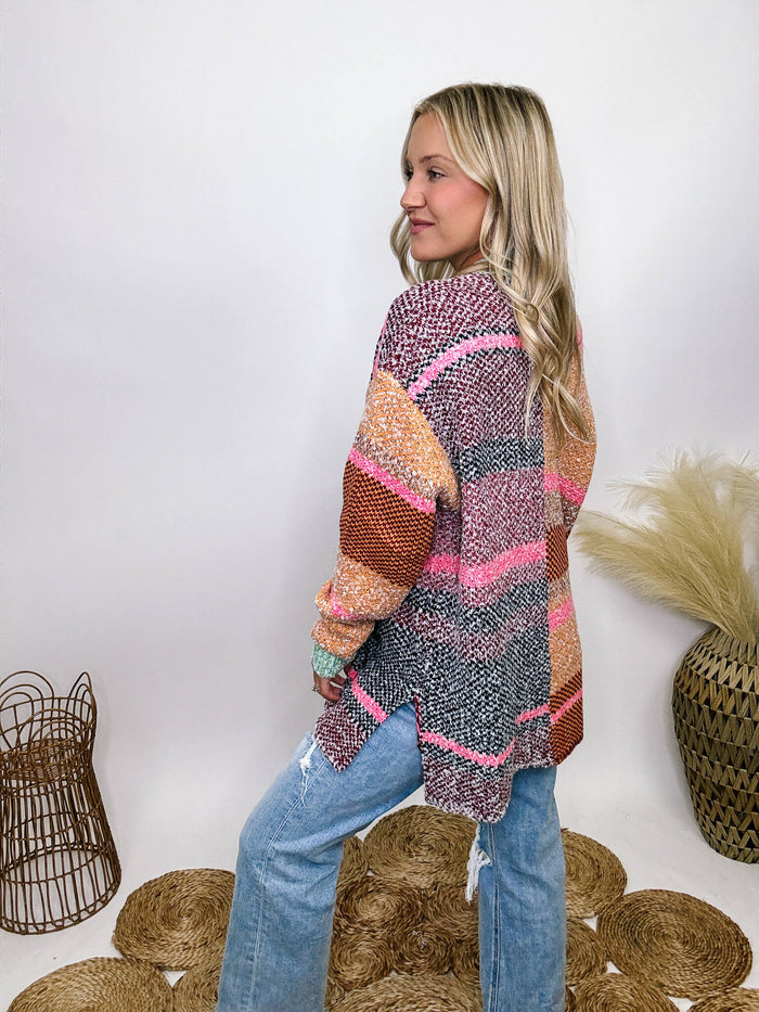 Multicolor colorblock cardigan with open front silhouette, side split hem, and long sleeves.