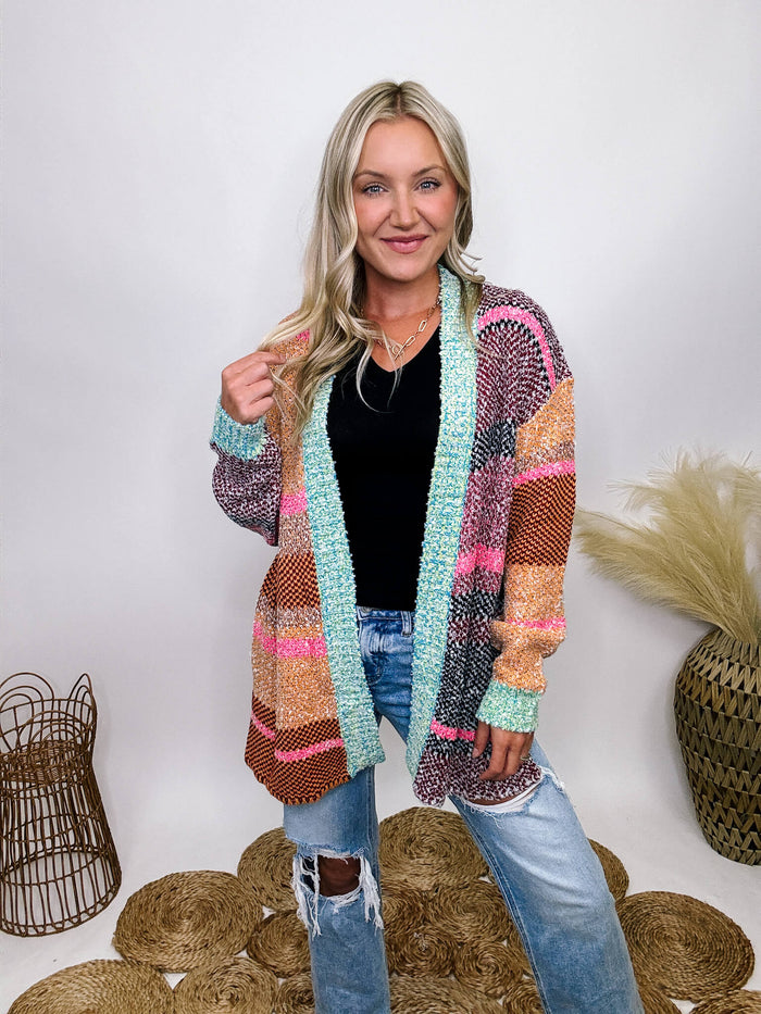 Multicolor colorblock cardigan with open front silhouette, side split hem, and long sleeves.