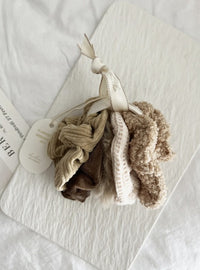 Set of 5 large winter scrunchies in neutral tones including caramel, taupe, and beige – perfect for holiday gifts and stocking stuffers.