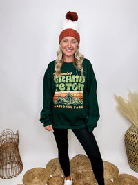 Golden Rose Co Retro Wyoming Grand Teton National Park oversized graphic sweatshirt in forest green, featuring a fleece-lined interior and a vintage-inspired mountain graphic.