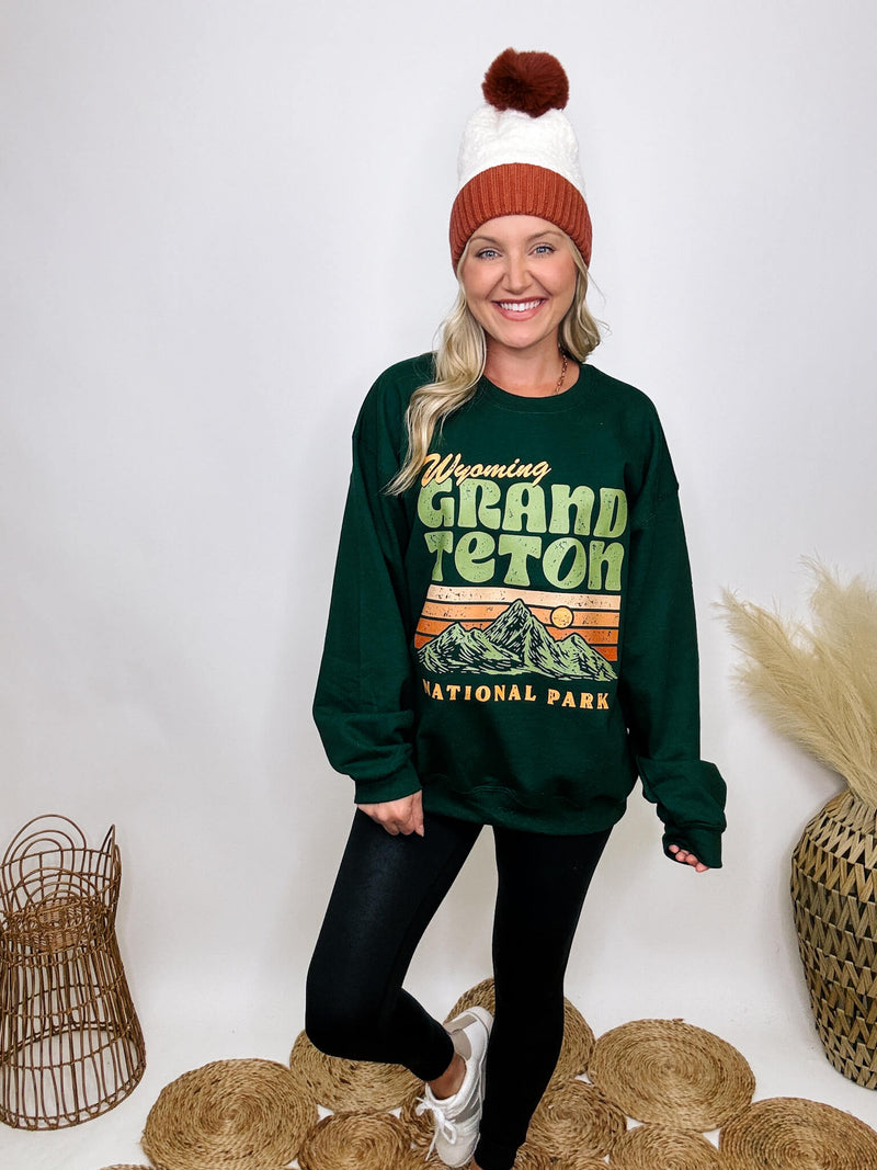 Golden Rose Co Retro Wyoming Grand Teton National Park oversized graphic sweatshirt in forest green, featuring a fleece-lined interior and a vintage-inspired mountain graphic.