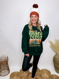 Golden Rose Co Retro Wyoming Grand Teton National Park oversized graphic sweatshirt in forest green, featuring a fleece-lined interior and a vintage-inspired mountain graphic.