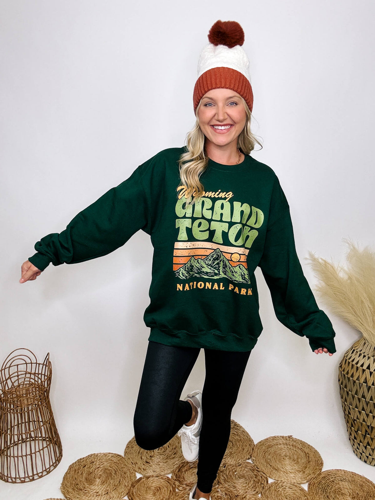 Golden Rose Co Retro Wyoming Grand Teton National Park oversized graphic sweatshirt in forest green, featuring a fleece-lined interior and a vintage-inspired mountain graphic.