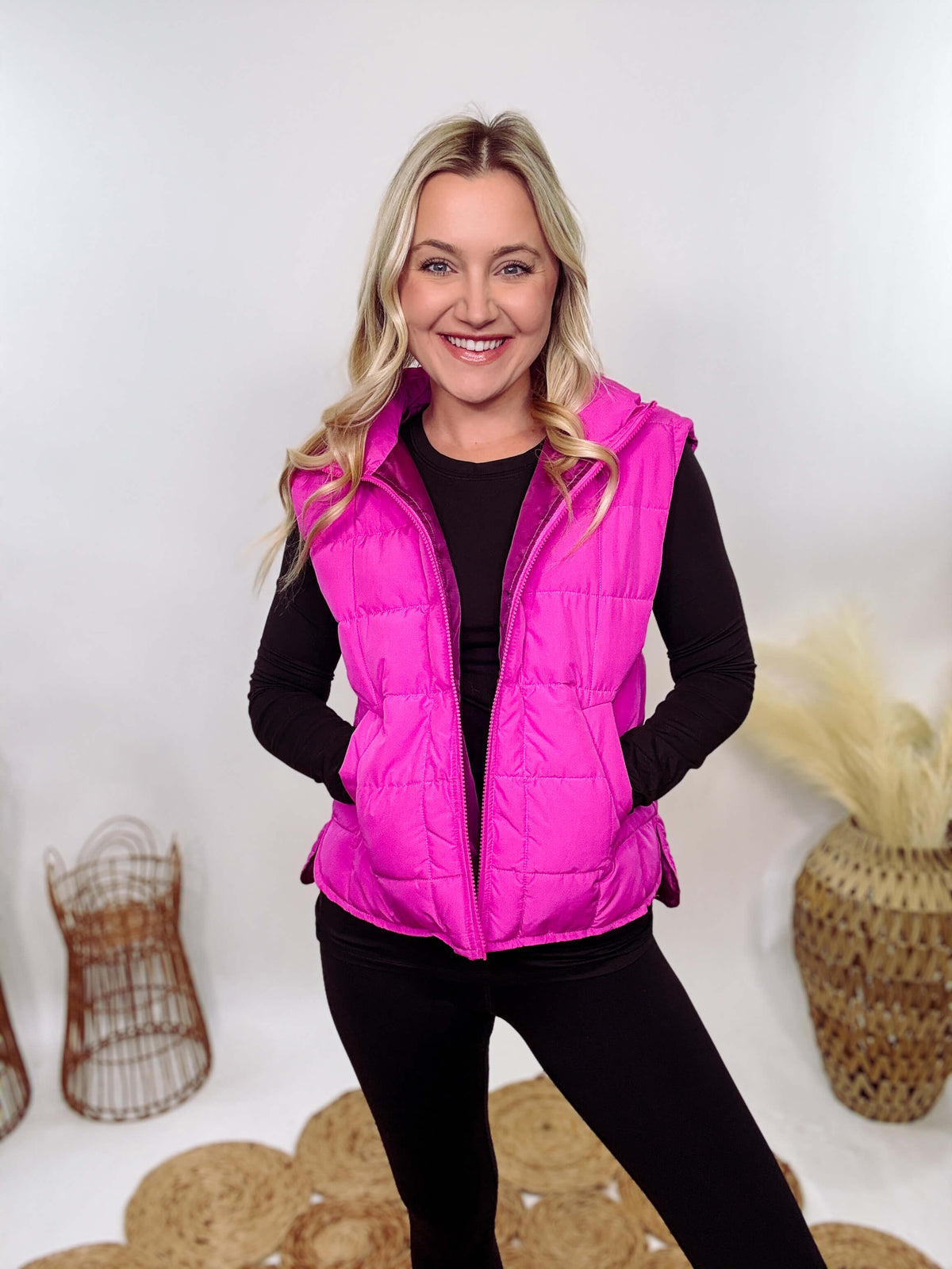 Hot Pink Zip-Up Puffer Vest with side slits and side pockets, perfect for layering in cooler spring weather.