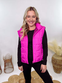 Hot Pink Zip-Up Puffer Vest with side slits and side pockets, perfect for layering in cooler spring weather.