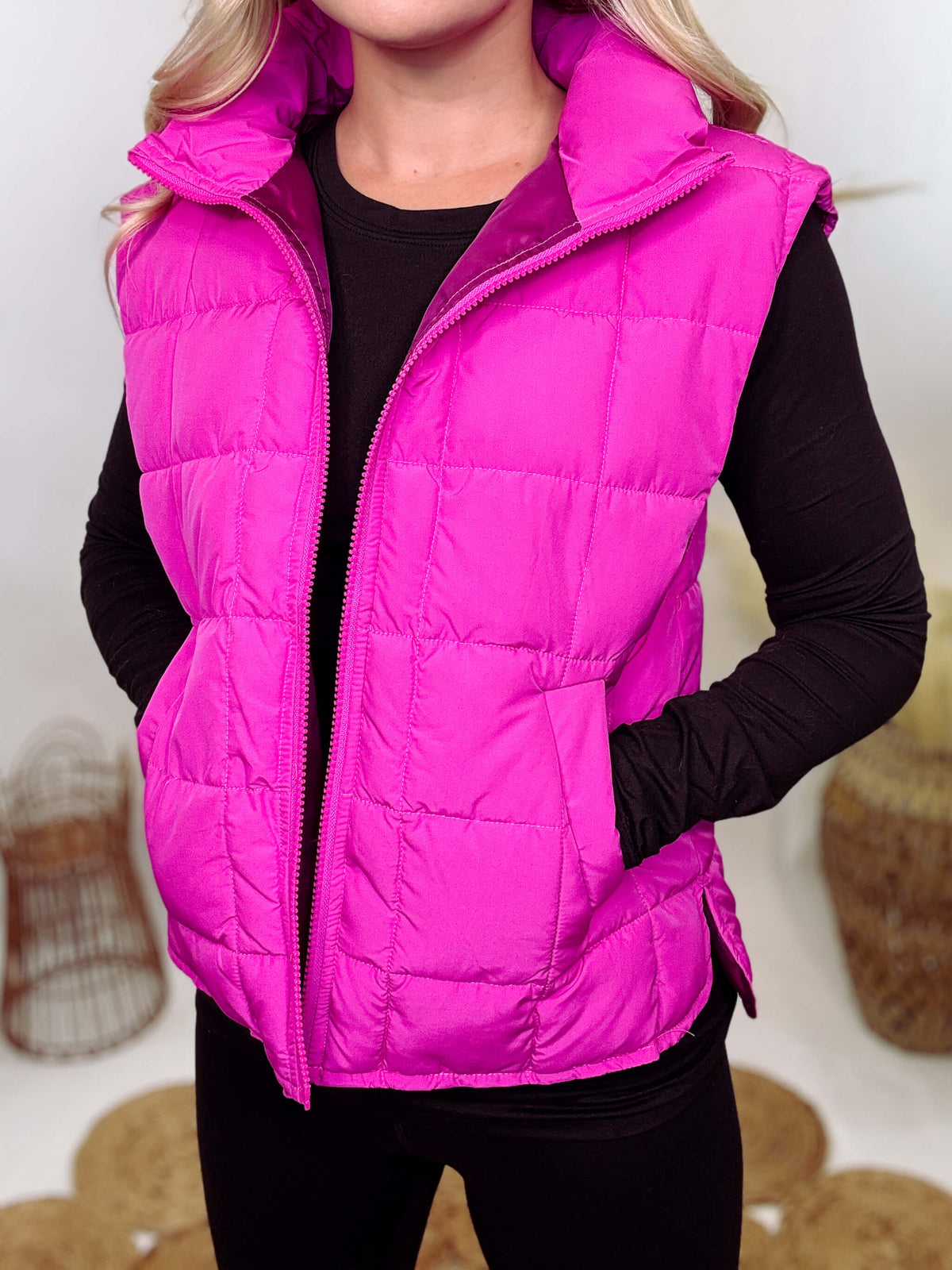 Hot Pink Zip-Up Puffer Vest with side slits and side pockets, perfect for layering in cooler spring weather.