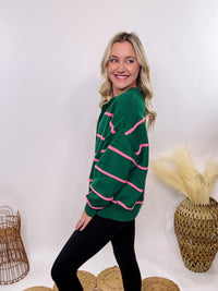 Hunter Green and Pink Stripe Henley Button-Down Oversized Sweater with a relaxed fit, ribbed hem, and soft, stretchy polyester fabric.