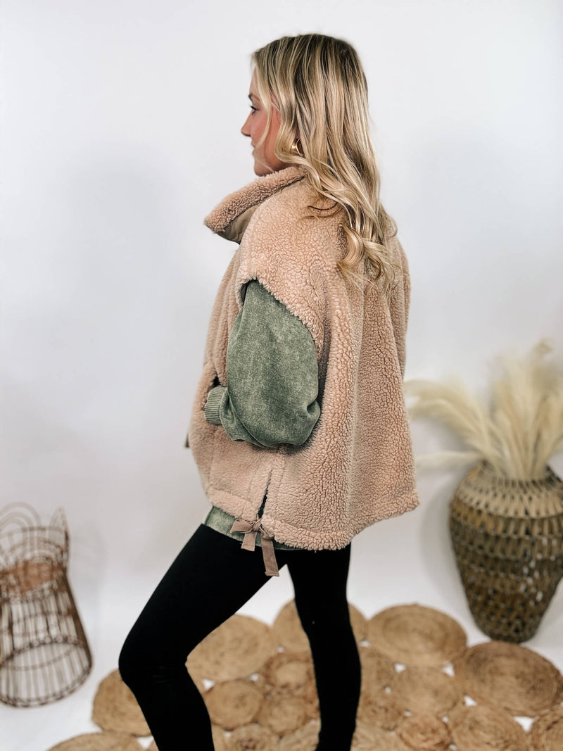 Hyfve tan camel sherpa vest with side ties, button-up front, and oversized cut creating a cap sleeve effect.
