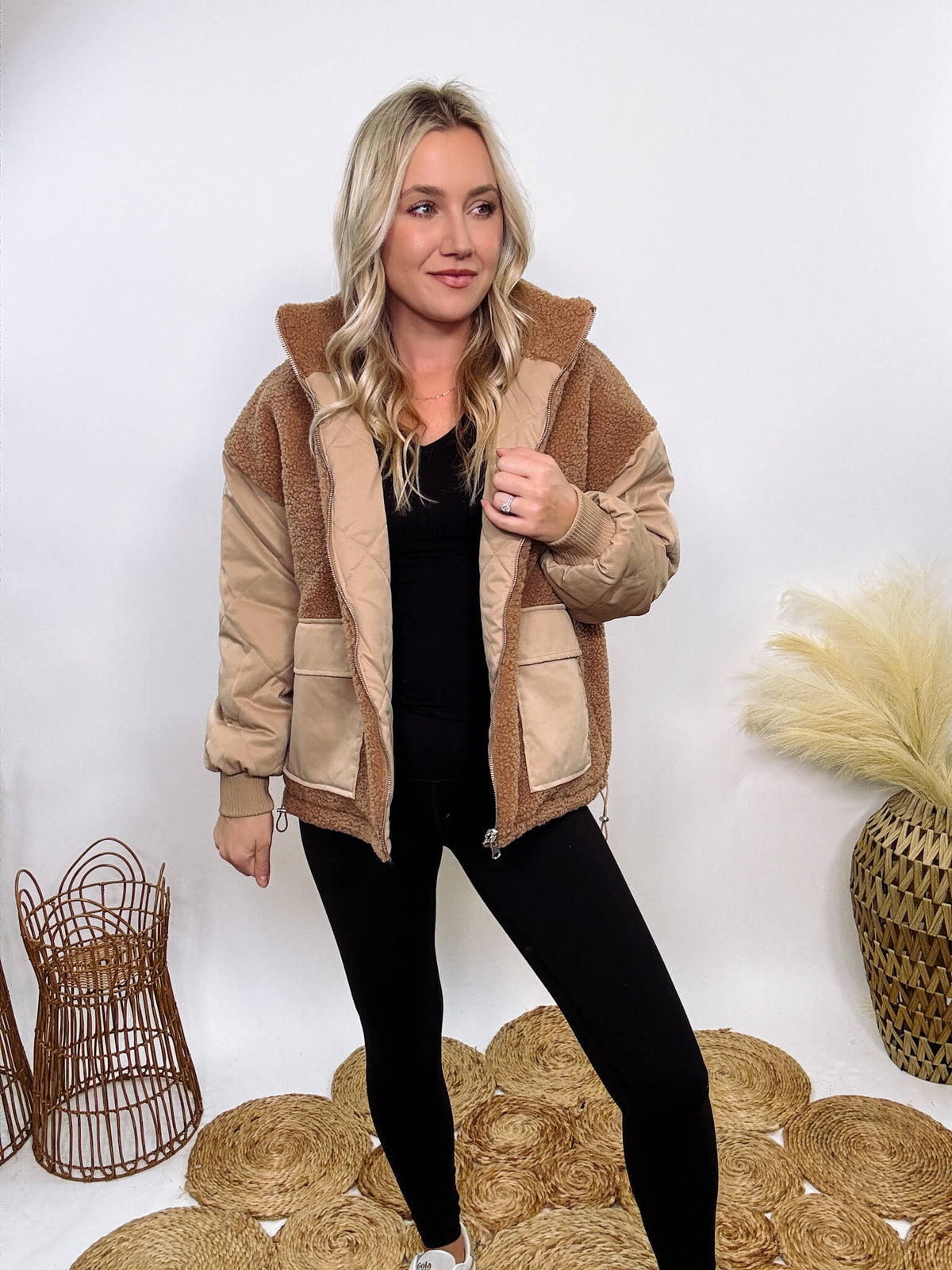 Hyfve - Embrace cozy style with our Reversible Sherpa Quilted Puffer Jacket in taupe camel. This warm, versatile jacket features a sherpa and quilted design, drop shoulders, and an adjustable waist toggle.