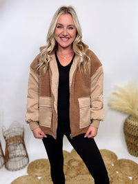 Hyfve - Embrace cozy style with our Reversible Sherpa Quilted Puffer Jacket in taupe camel. This warm, versatile jacket features a sherpa and quilted design, drop shoulders, and an adjustable waist toggle.