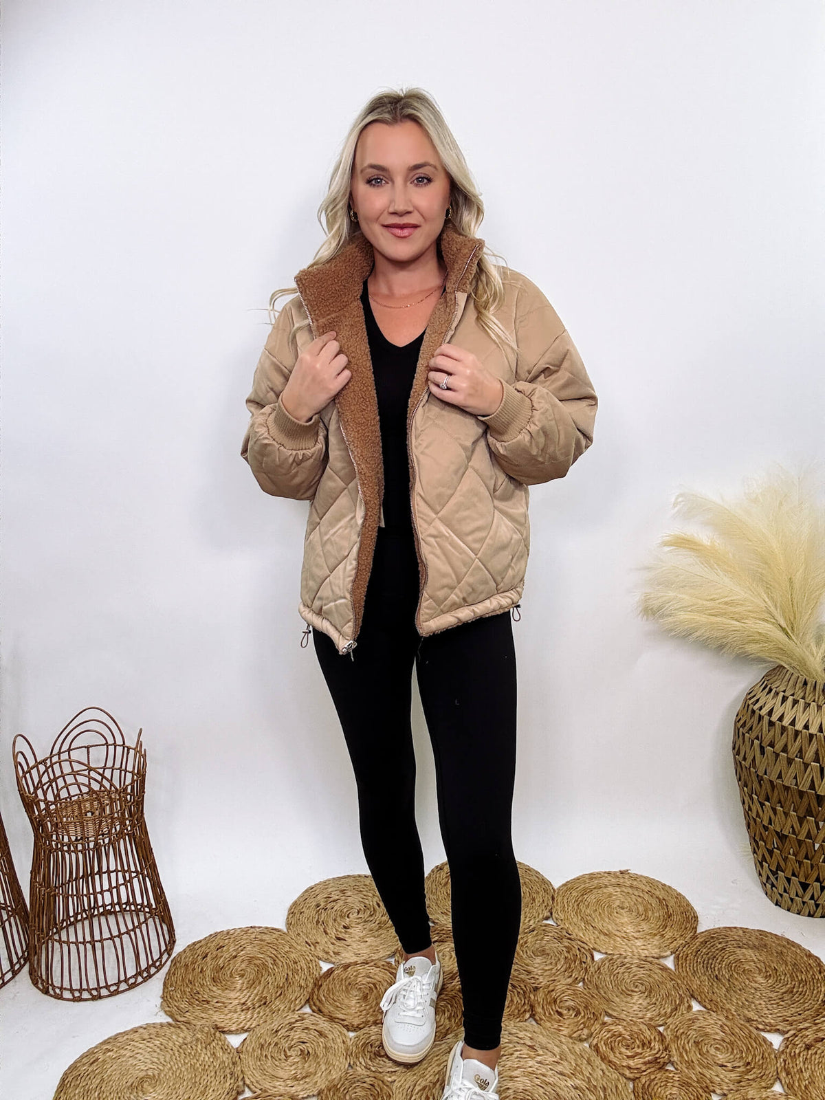 Hyfve - Embrace cozy style with our Reversible Sherpa Quilted Puffer Jacket in taupe camel. This warm, versatile jacket features a sherpa and quilted design, drop shoulders, and an adjustable waist toggle.