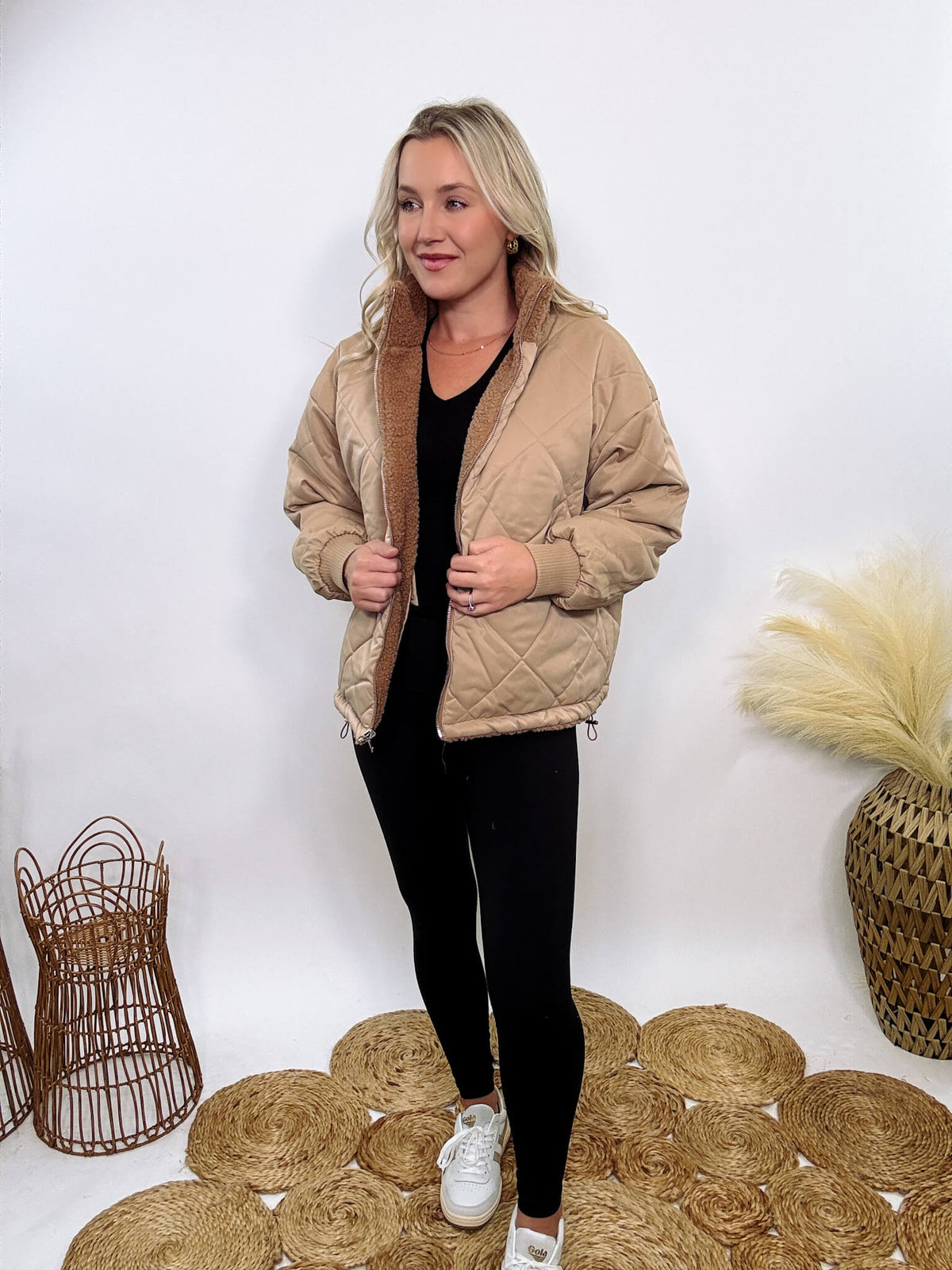 Hyfve - Embrace cozy style with our Reversible Sherpa Quilted Puffer Jacket in taupe camel. This warm, versatile jacket features a sherpa and quilted design, drop shoulders, and an adjustable waist toggle.